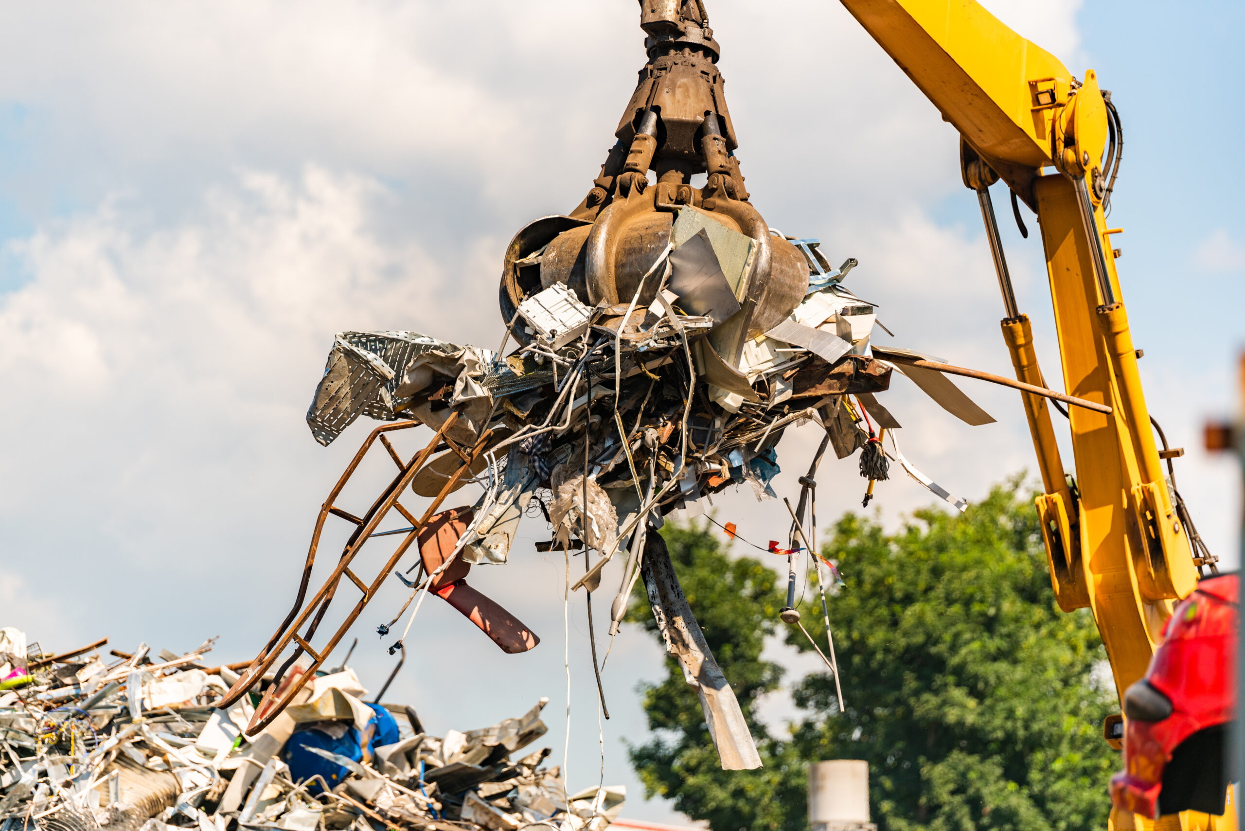 Close-up of a crane for recycling metallic waste on scrapyard
